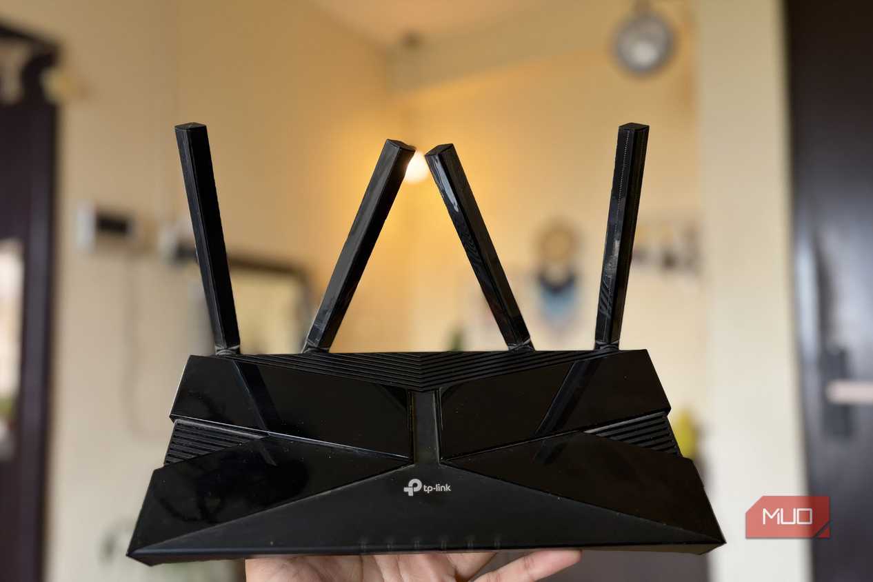 TP-Link Wi-Fi 6 router full body with antennas in hand