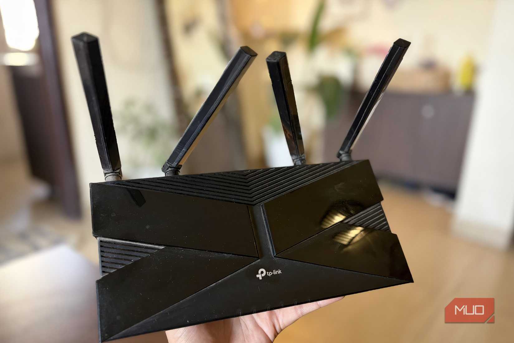 TP-Link Wi-Fi 6 router in hand