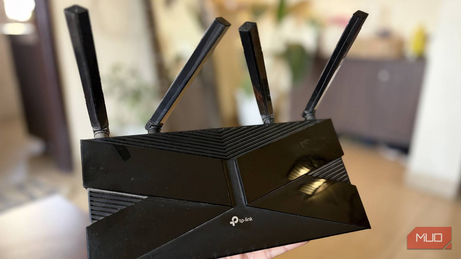 TP-Link Wi-Fi 6 router in hand
