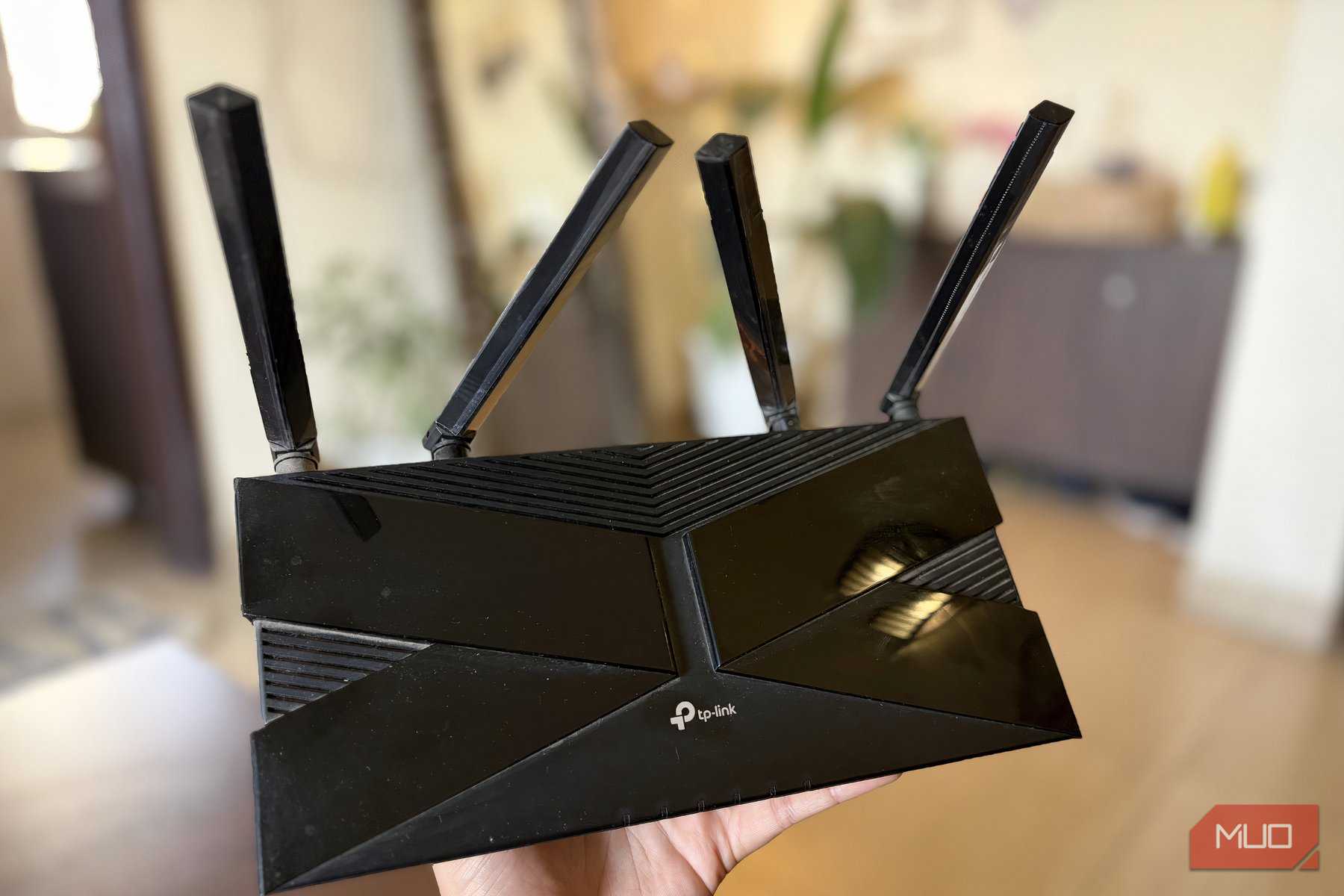TP-Link Wi-Fi 6 router in hand