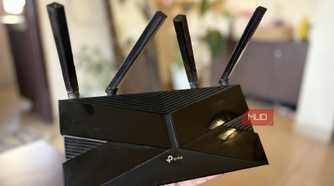TP-Link Wi-Fi 6 router in hand