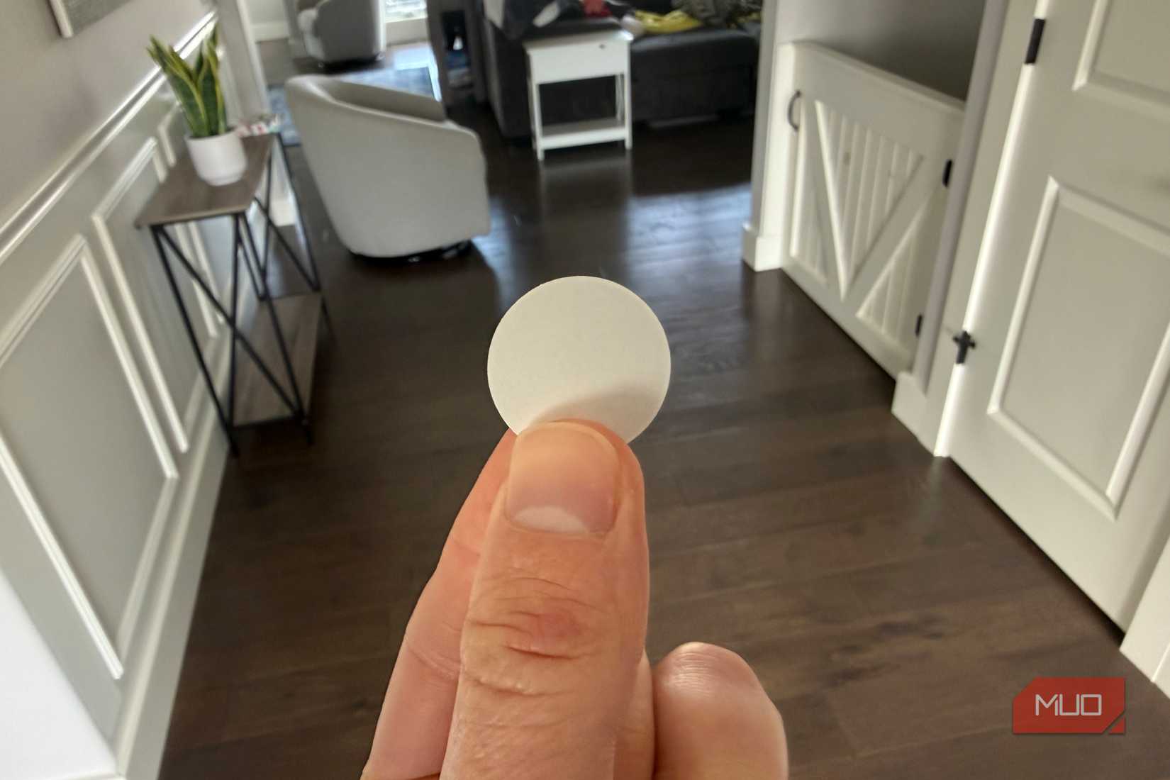 white nfc tag in hand