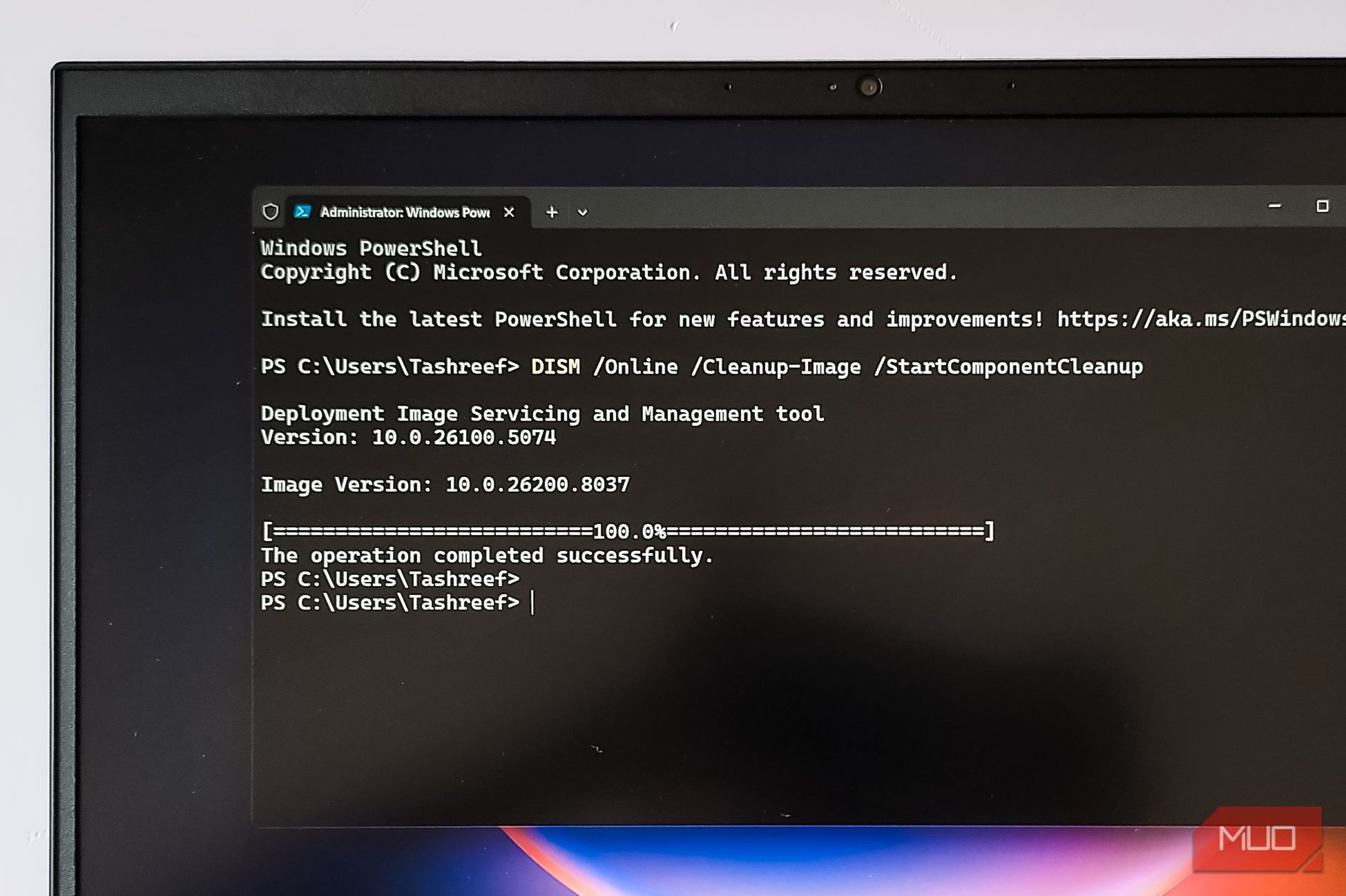 Windows terminal open with DISM command open on a HP Pavillion laptop