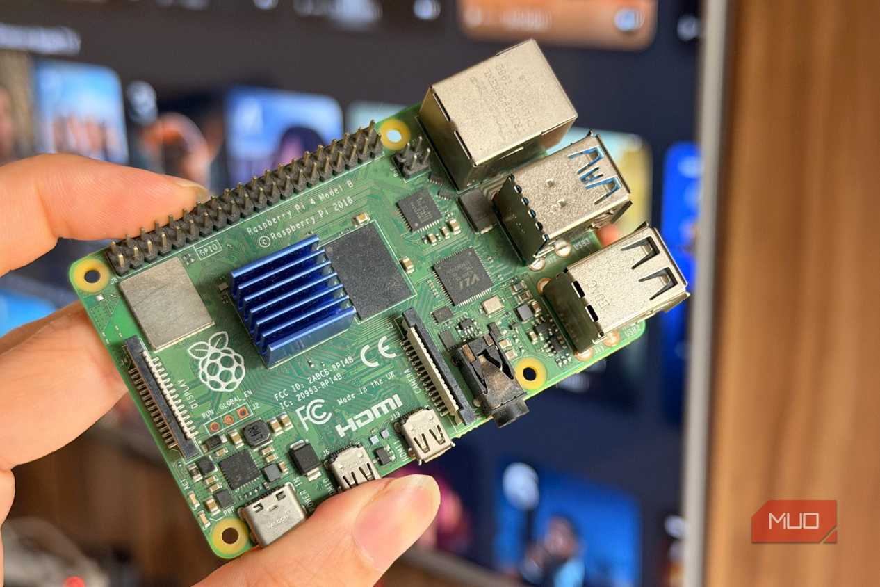 A Raspberry Pi 4 held in front of a smart TV