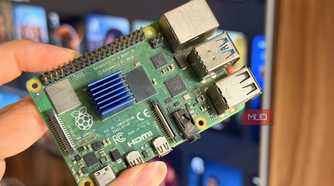 A Raspberry Pi 4 held in front of a smart TV