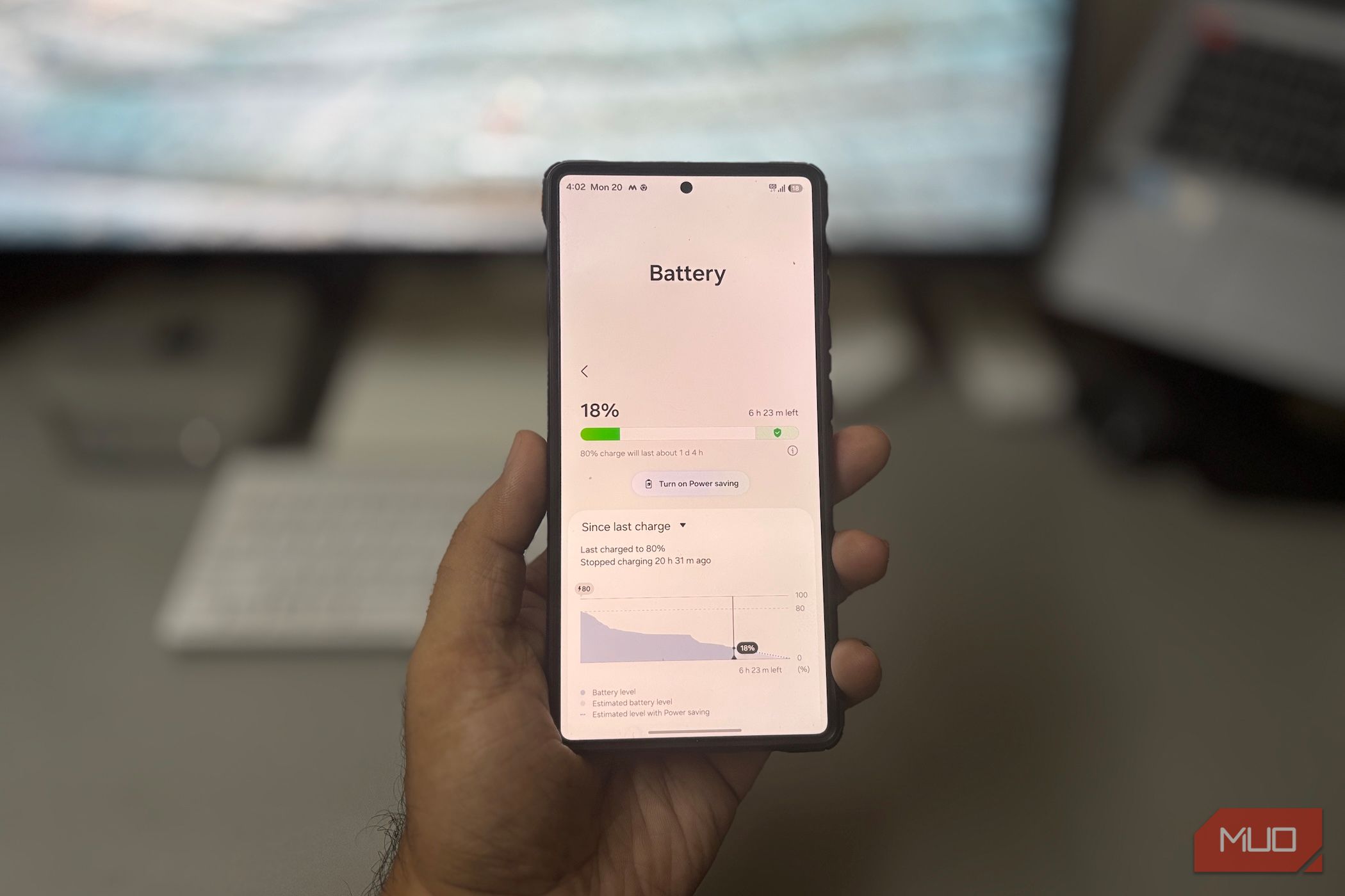 Android phone battery screen in hand