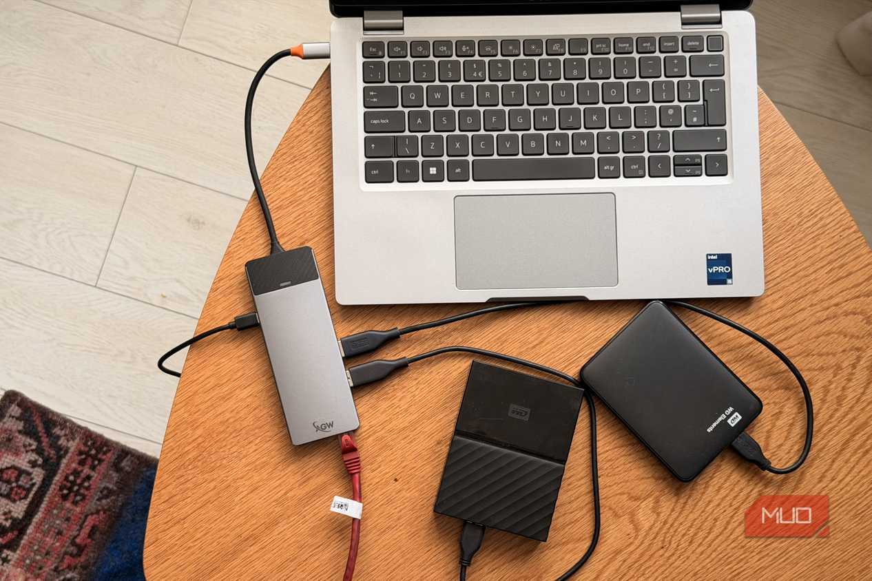 Dell Latitude connected to USB-C Thunderbolt hub with two external hard drives