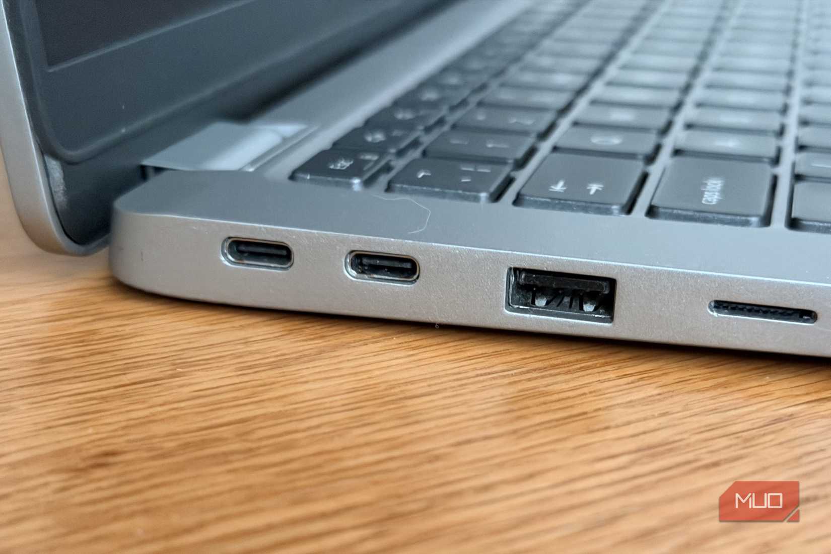 Dell Latitude left side close-up showing two USB-C Thunderbolt ports and USB-A