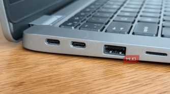 Dell Latitude left side close-up showing two USB-C Thunderbolt ports and USB-A
