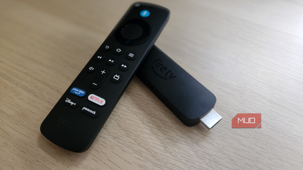 Fire TV Stick and remote on a desk.