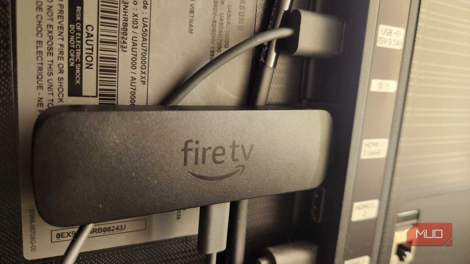 Fire TV Stick plugged into a TV.