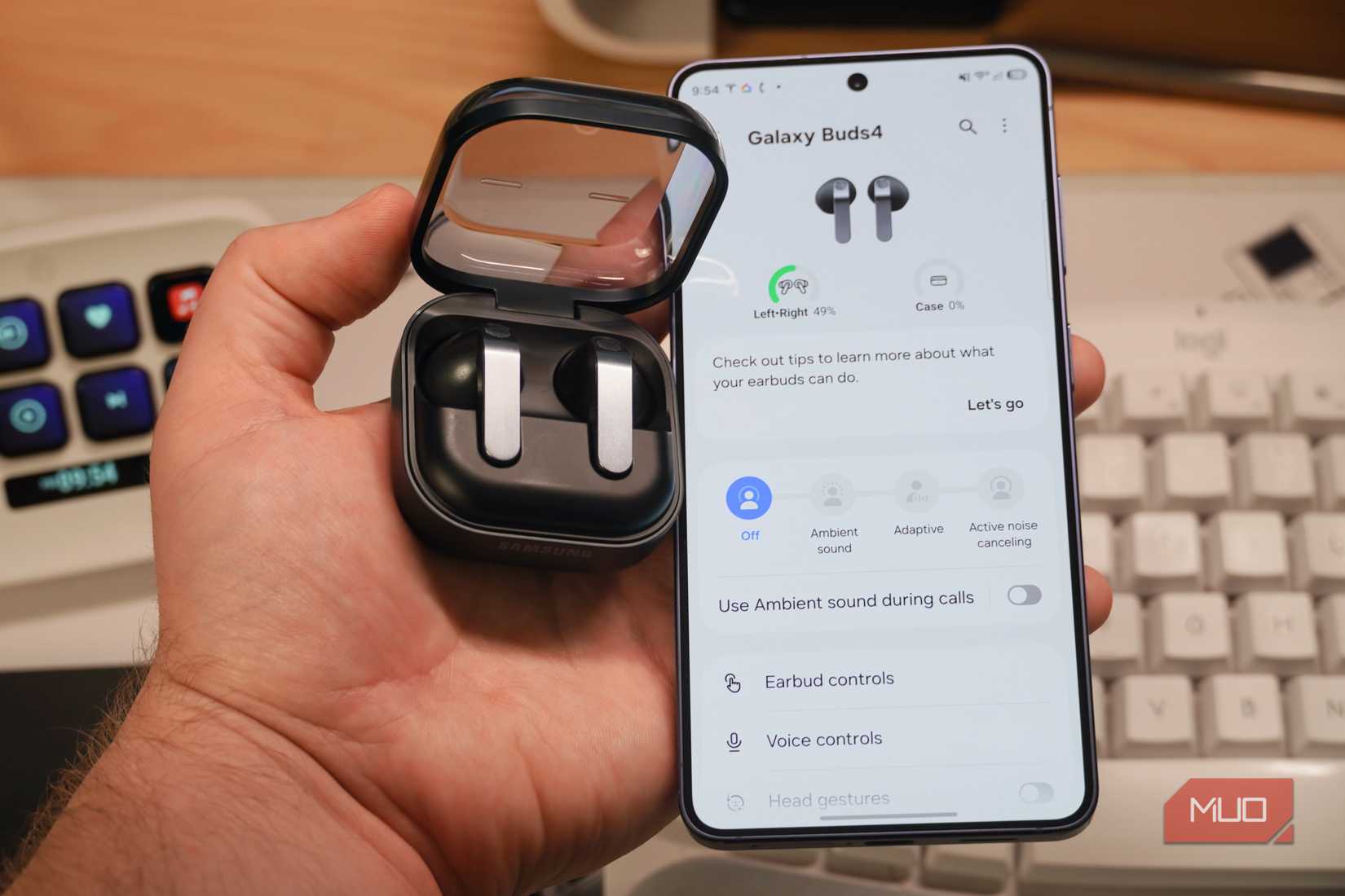 Samsung earbuds beside a Galaxy S26.