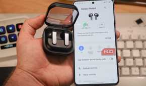 Samsung earbuds beside a Galaxy S26.