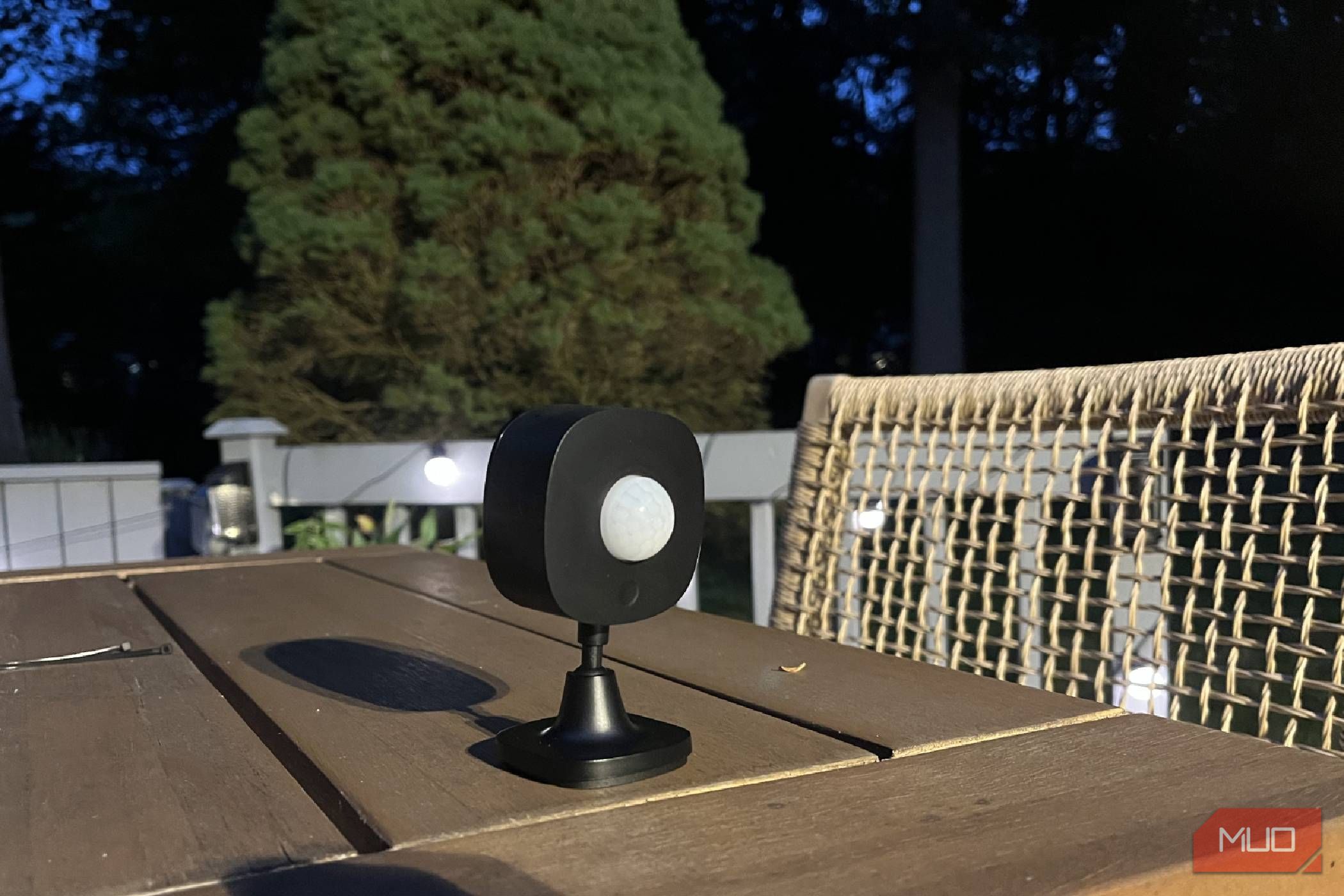 A Govee Outdoor Motion Sensor on a table