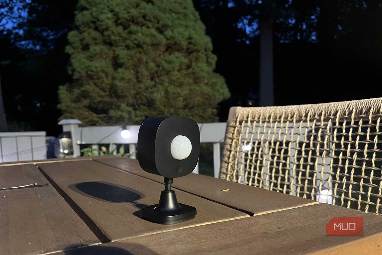 A Govee Outdoor Motion Sensor on a table