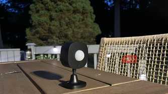 A Govee Outdoor Motion Sensor on a table