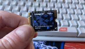 Integral NVMe 2230 SSD being held in front of a keyboard