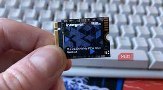 Integral NVMe 2230 SSD being held in front of a keyboard
