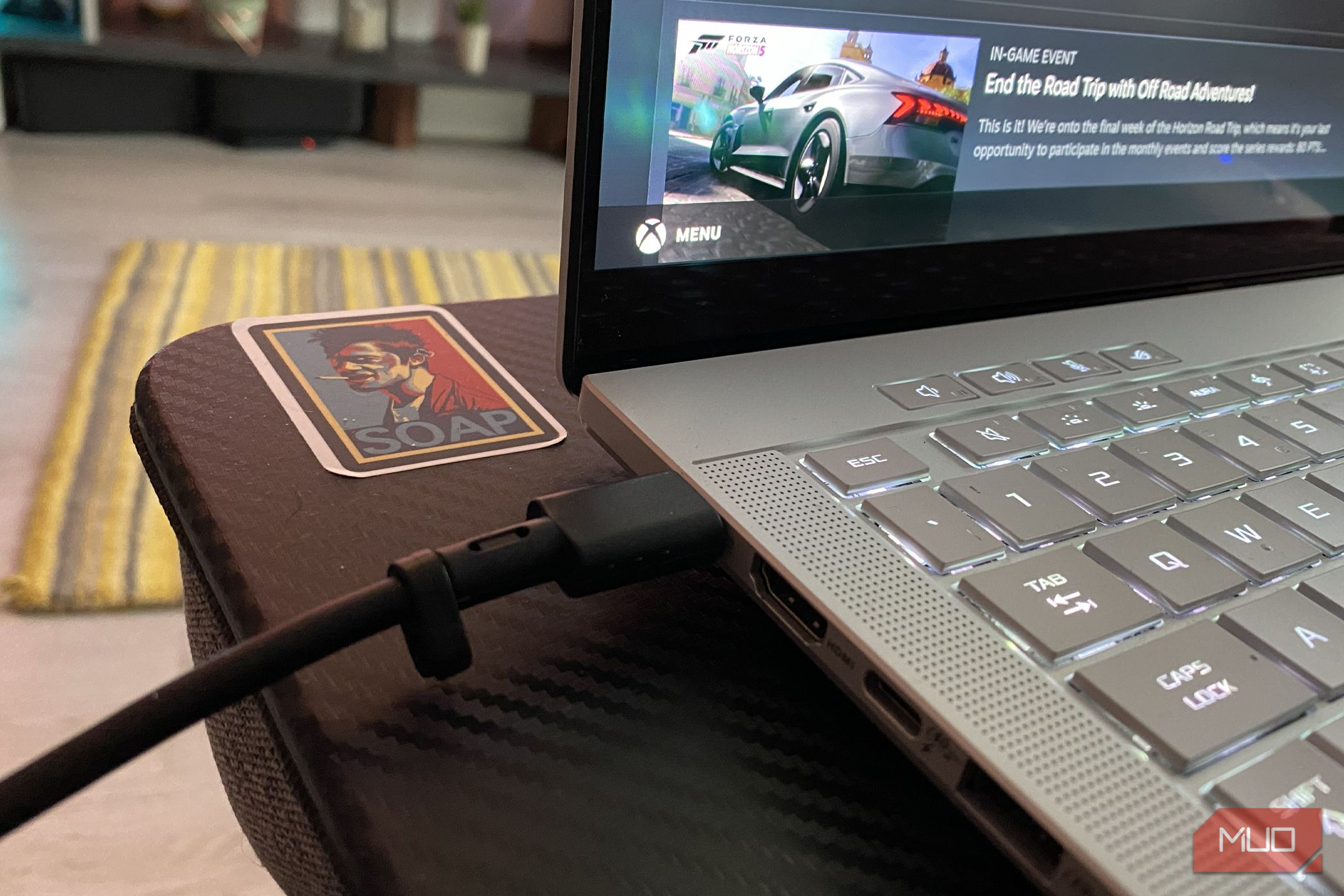 USB-C cable connected to a gaming laptop