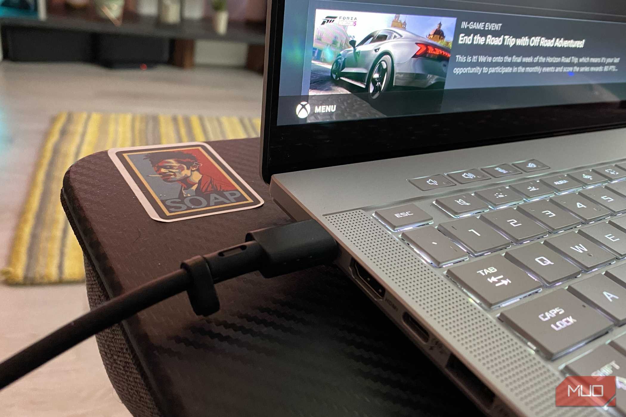 USB-C cable connected to a gaming laptop