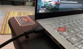 USB-C cable connected to a gaming laptop