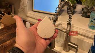 A Moen Leak Detector near a faucet