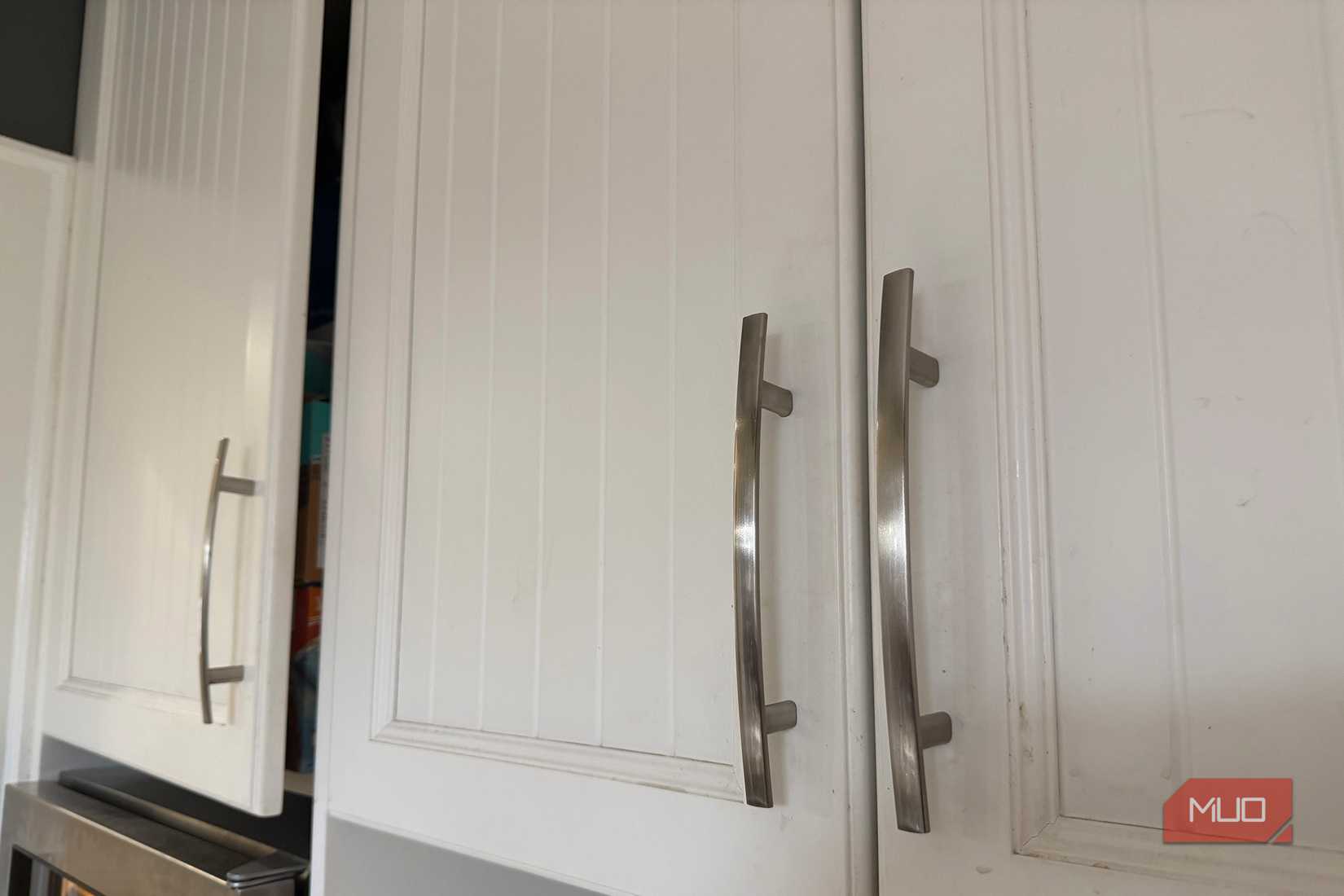 Pantry doors with one slightly open.