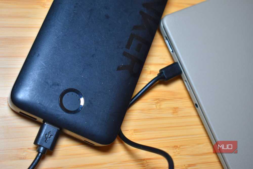 A power bank charging a laptop via USB-C Power Delivery