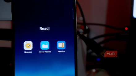 an Android smartphone showing a number of reading apps with a few cables in the background