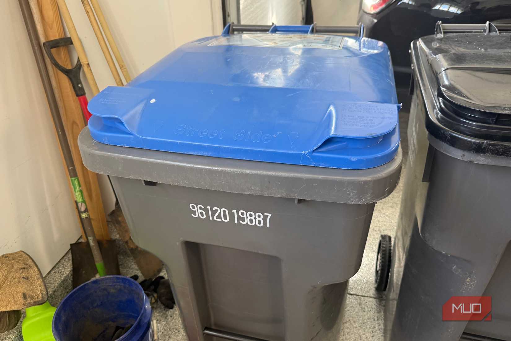 recycling bin in garage  lid closed