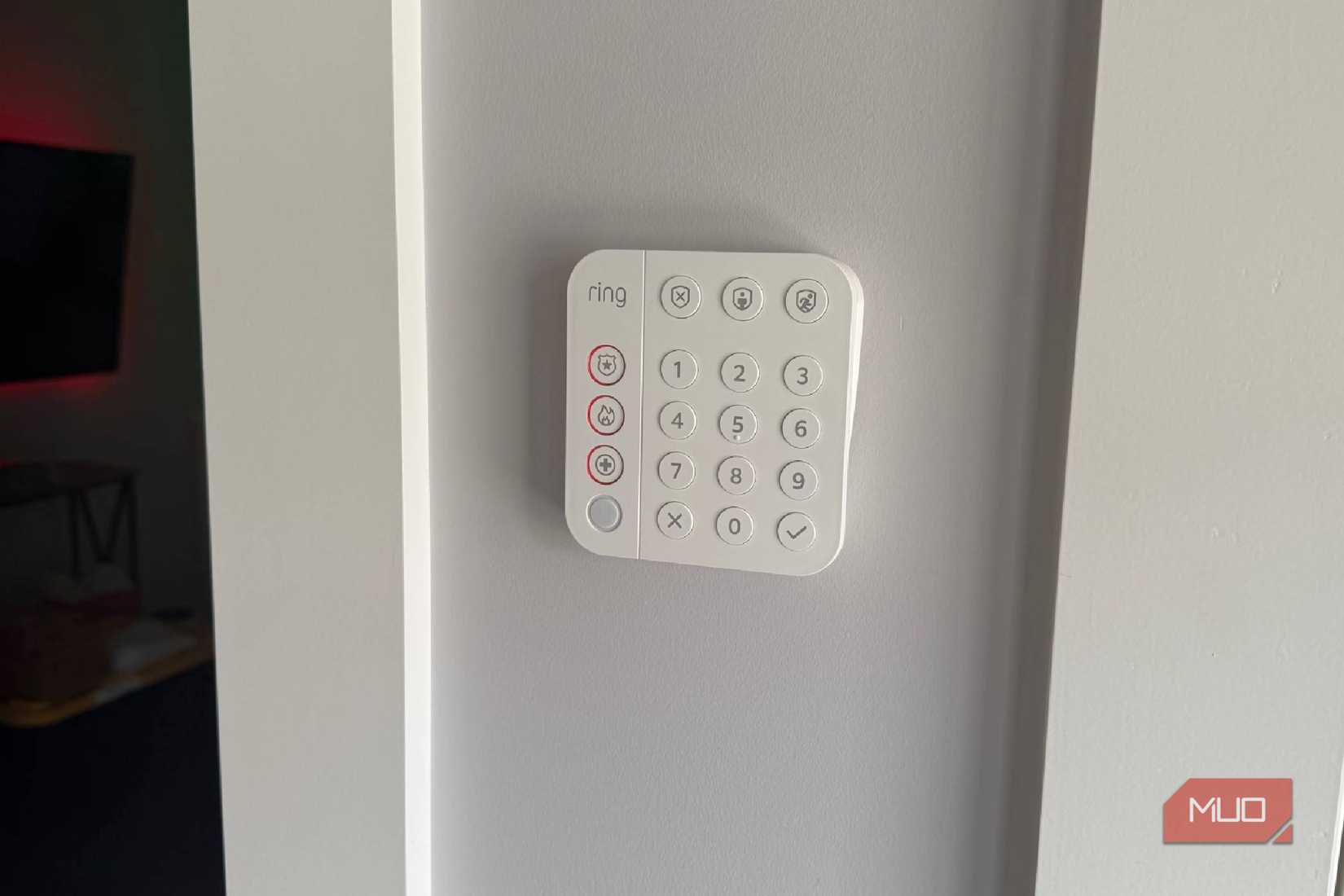 A Ring alarm system keypad mounted on a wall