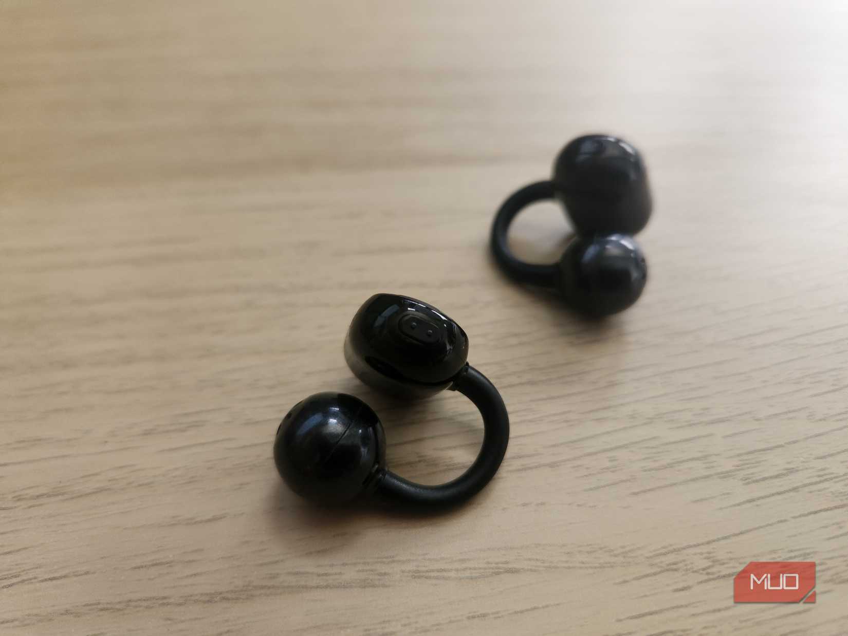 Soundpeats headphones on a desk.