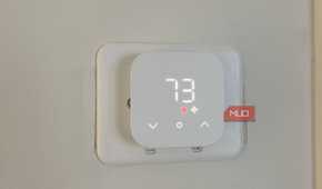 Amazon Smart Thermostat on a wall