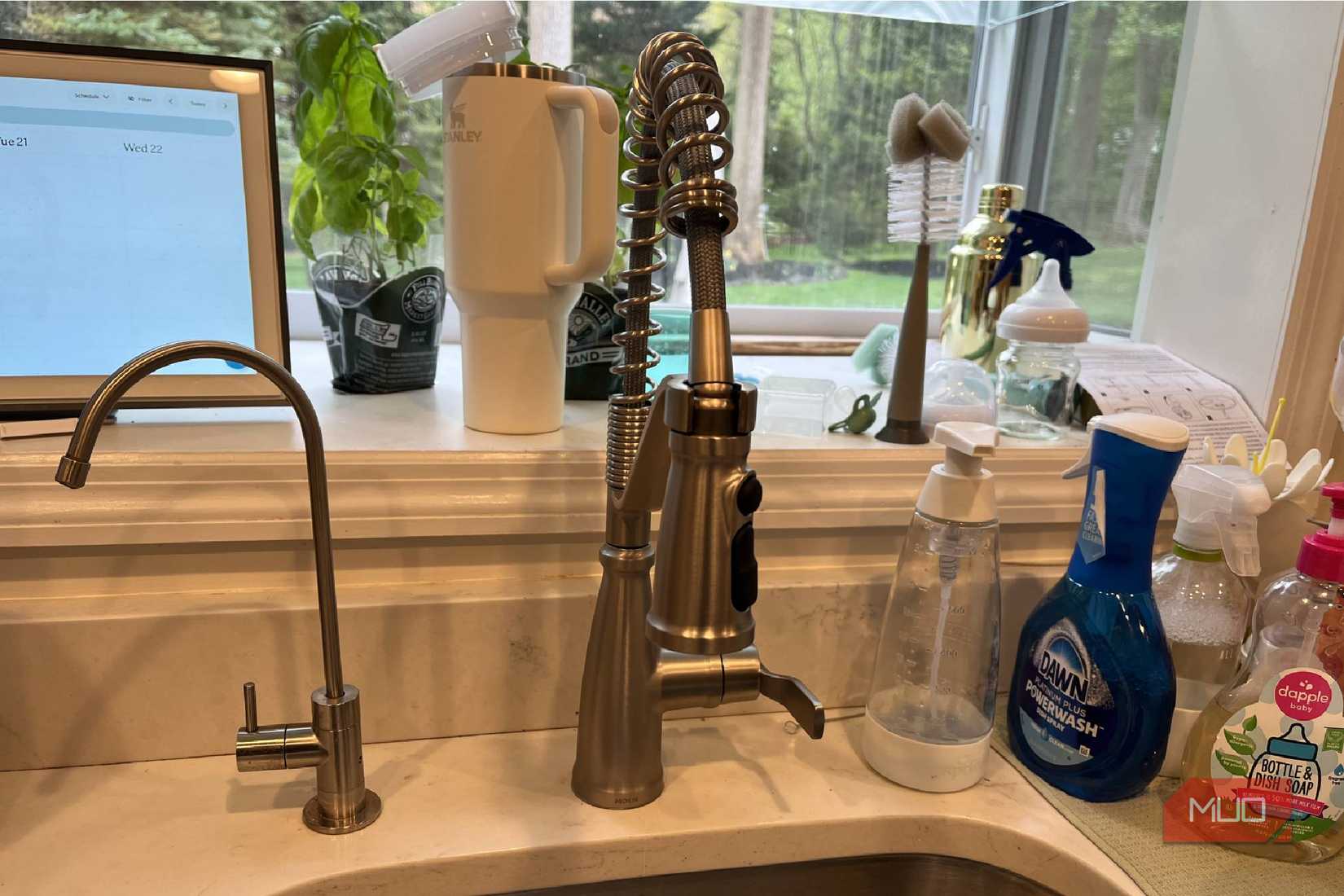 A Moen kitchen faucet in a sink