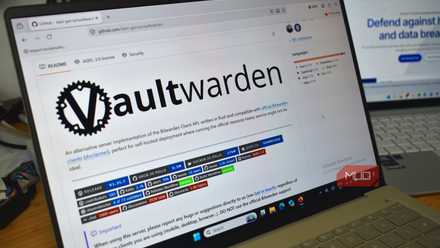vaultwarden github on laptop screen bitwarden background.