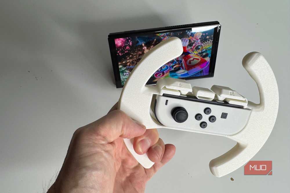 The racing wheel attachment works with Mario Kart and other driving games