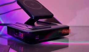 wireless charging pad on black charging dock with purple neon lighting