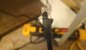 A good Ethernet cord in front of a power strip