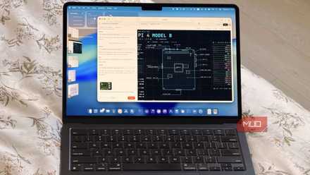 A MacBook laptop showing Claude Design building an infographic