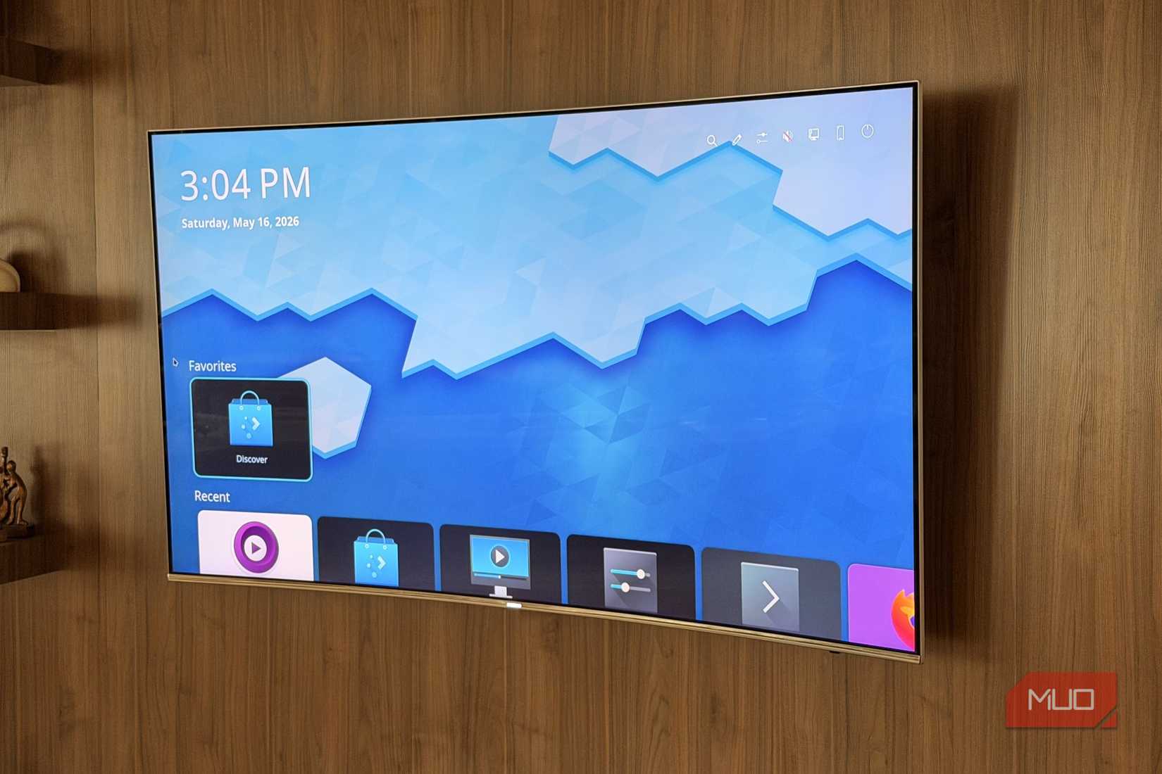 A smart TV showing the app drawer in KDE Neon running Plasma Big Screen