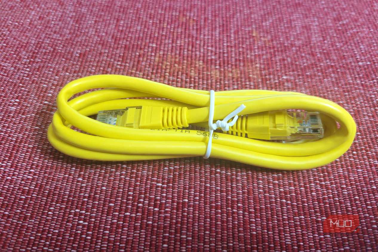 A yellow generic Ethernet cable tied up