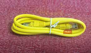 A yellow generic Ethernet cable tied up