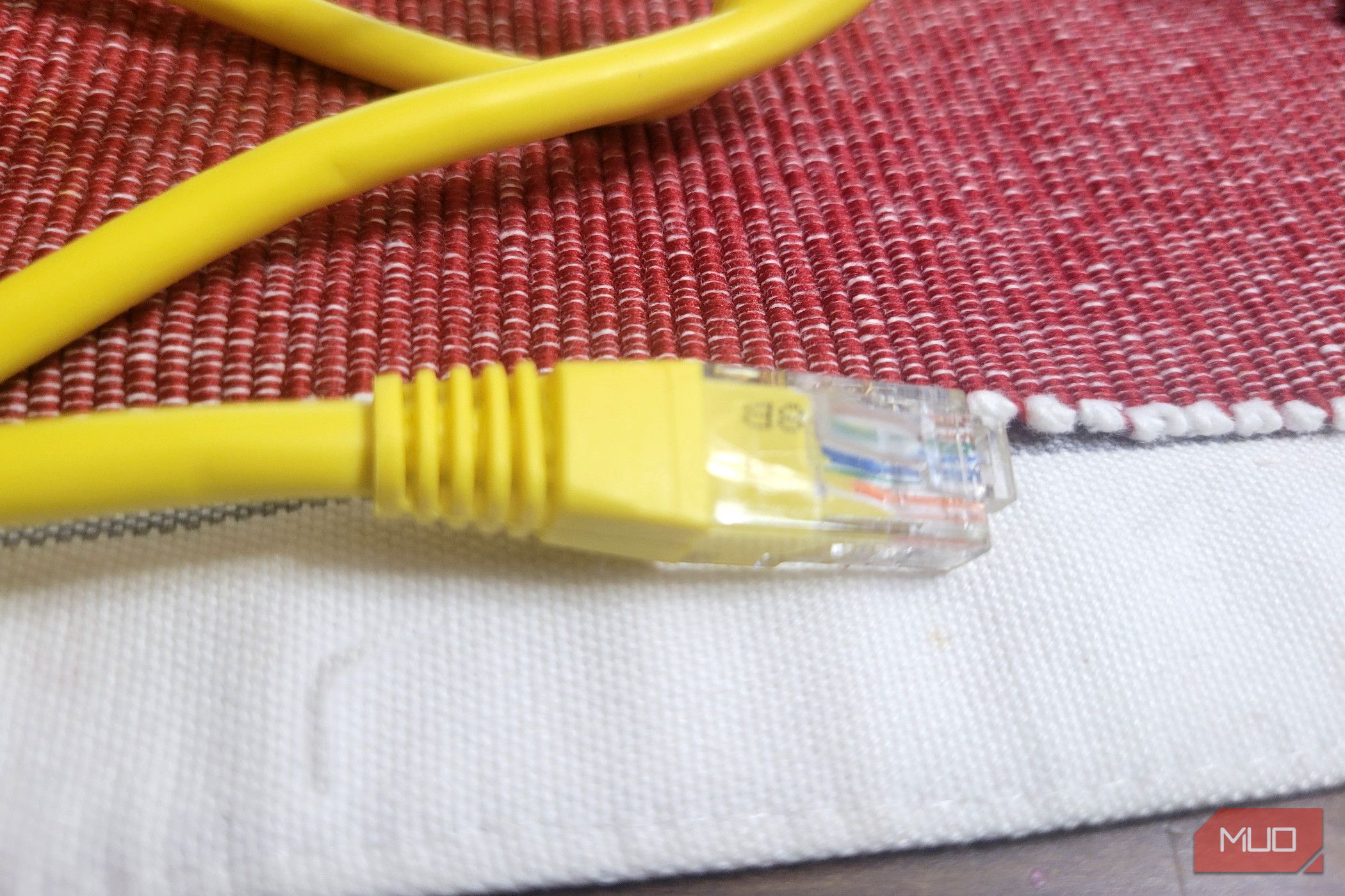 An Ethernet cable on a white and red thing-2
