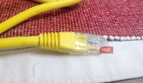 An Ethernet cable on a white and red thing-2