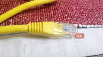 An Ethernet cable on a white and red thing-2