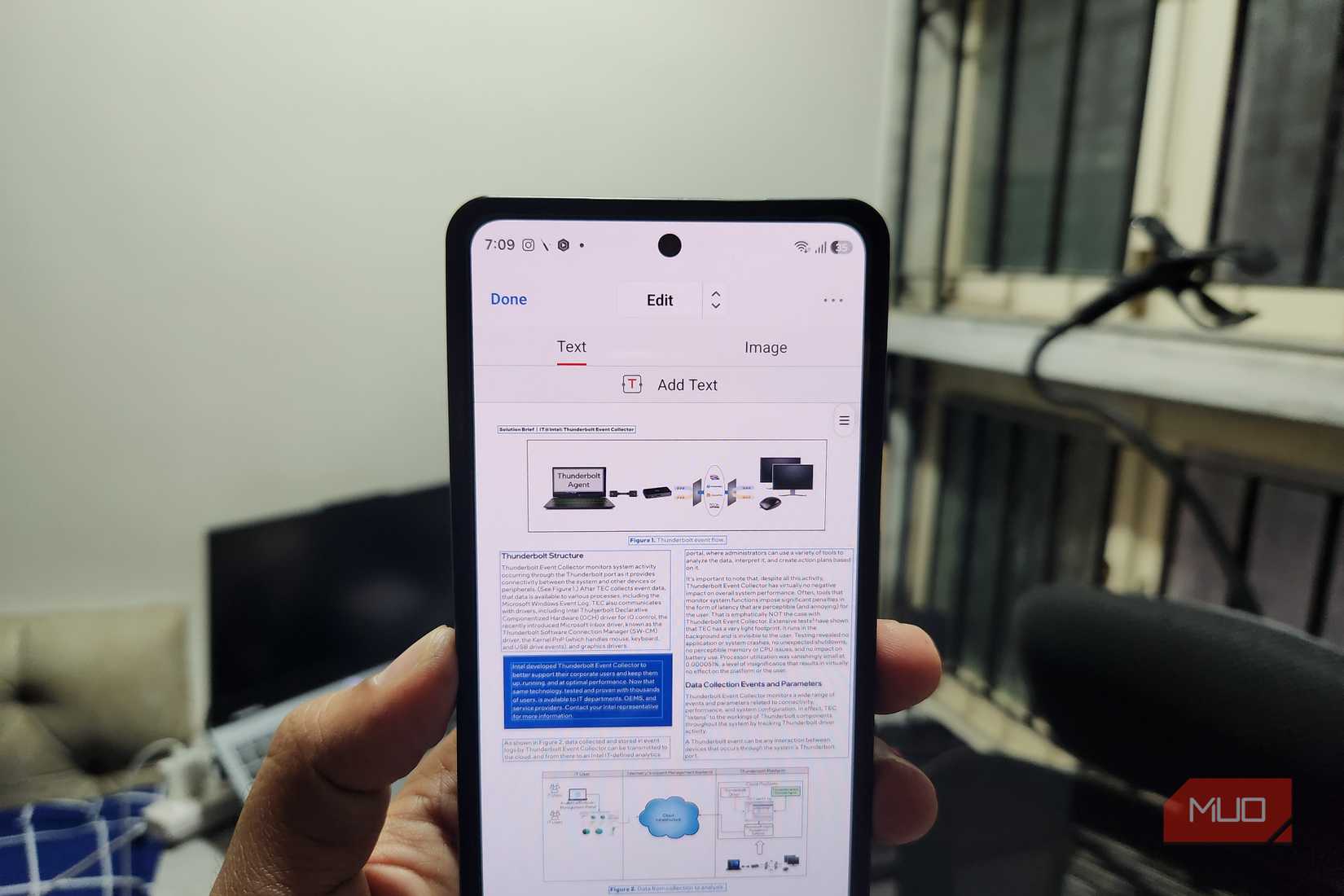 Android phone in hand showing PDF editor