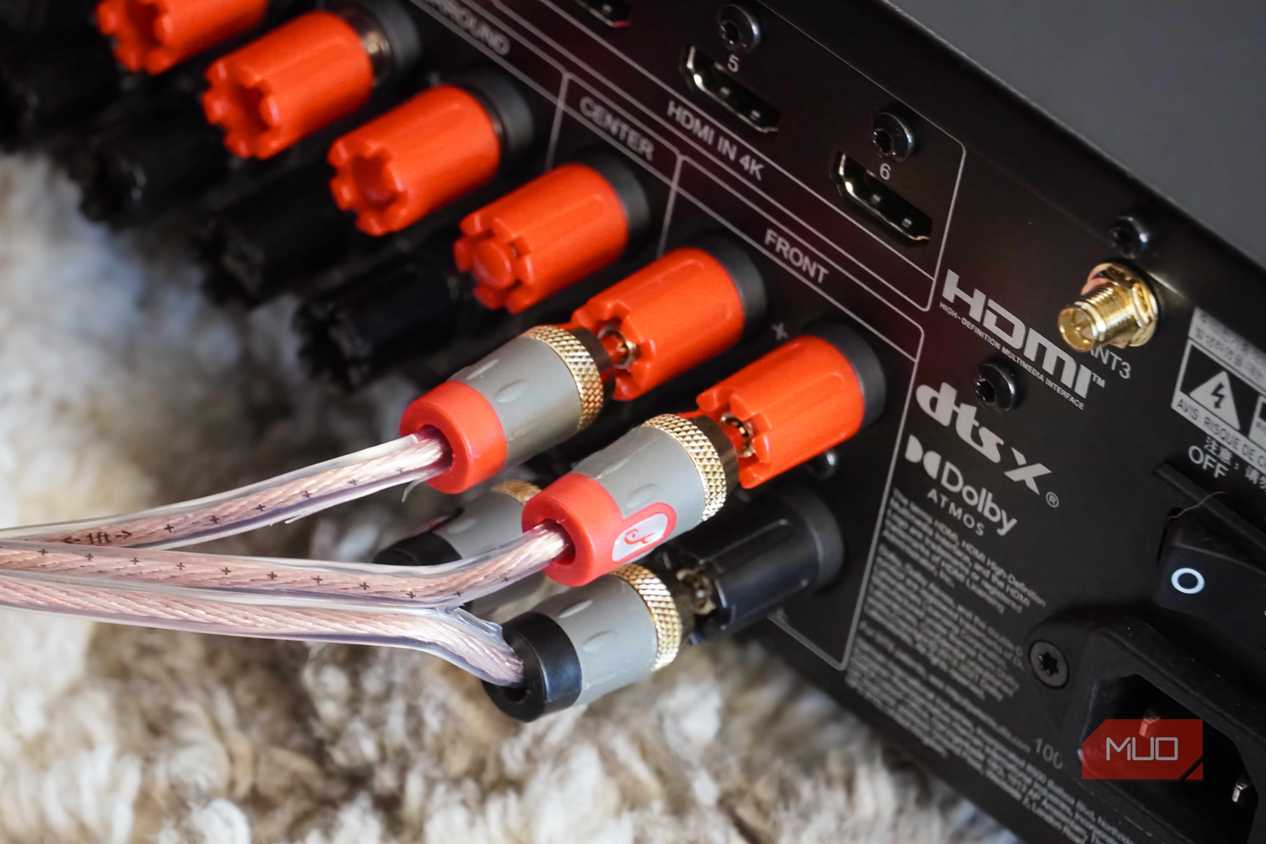 The back of a receiver connected to banana plugs.