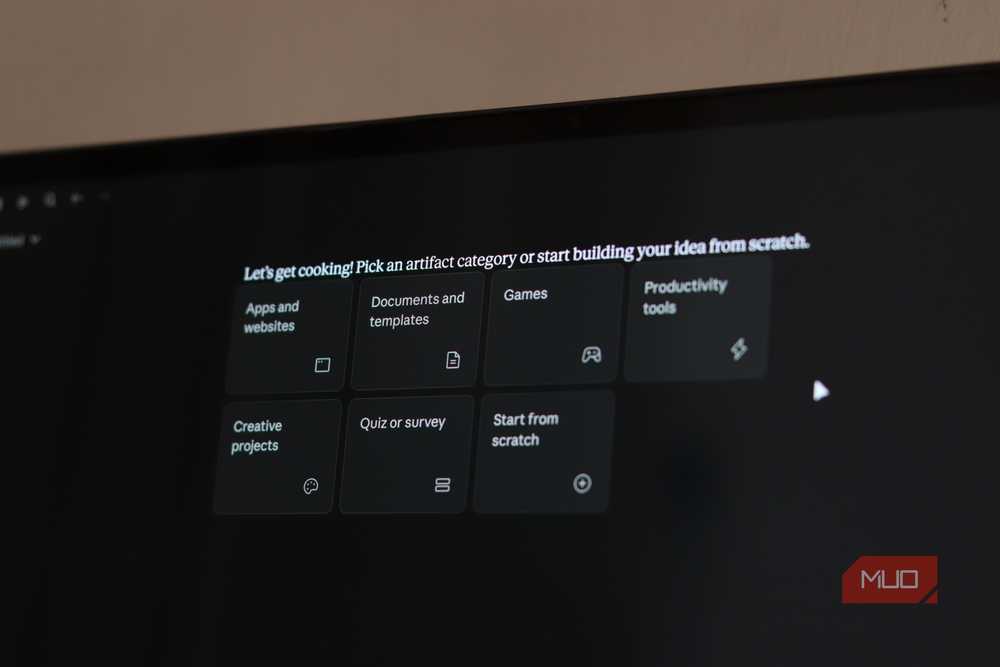 The artifact creation screen lets users pick from apps, games, documents, and productivity tools