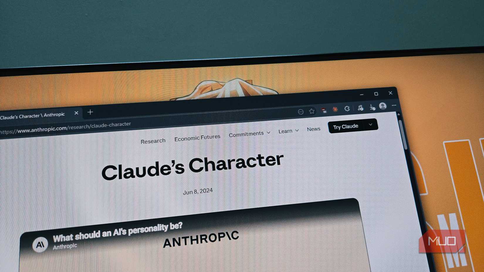 Claude's character page open on a BENQ monitor