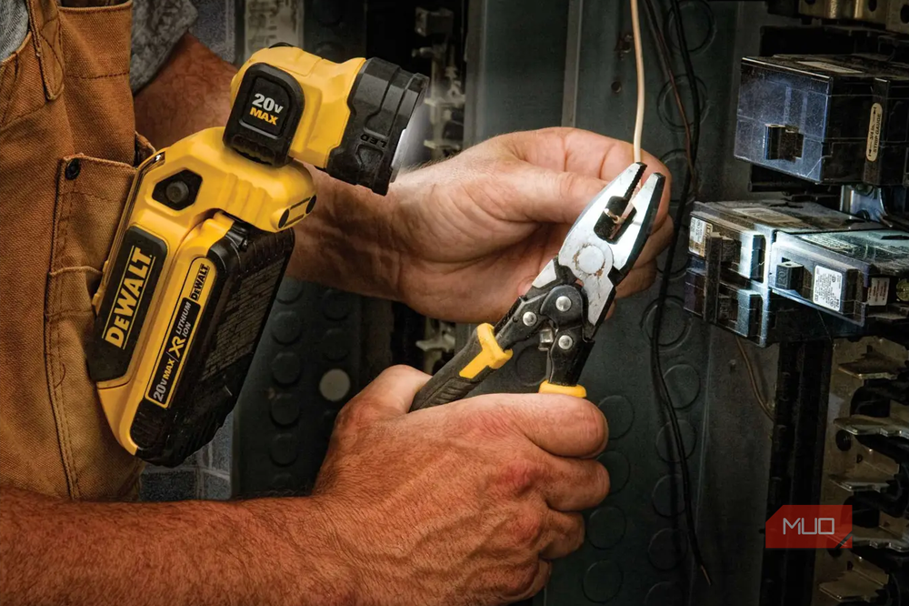 The DeWalt work light clips directly to overalls for hands-free illumination
